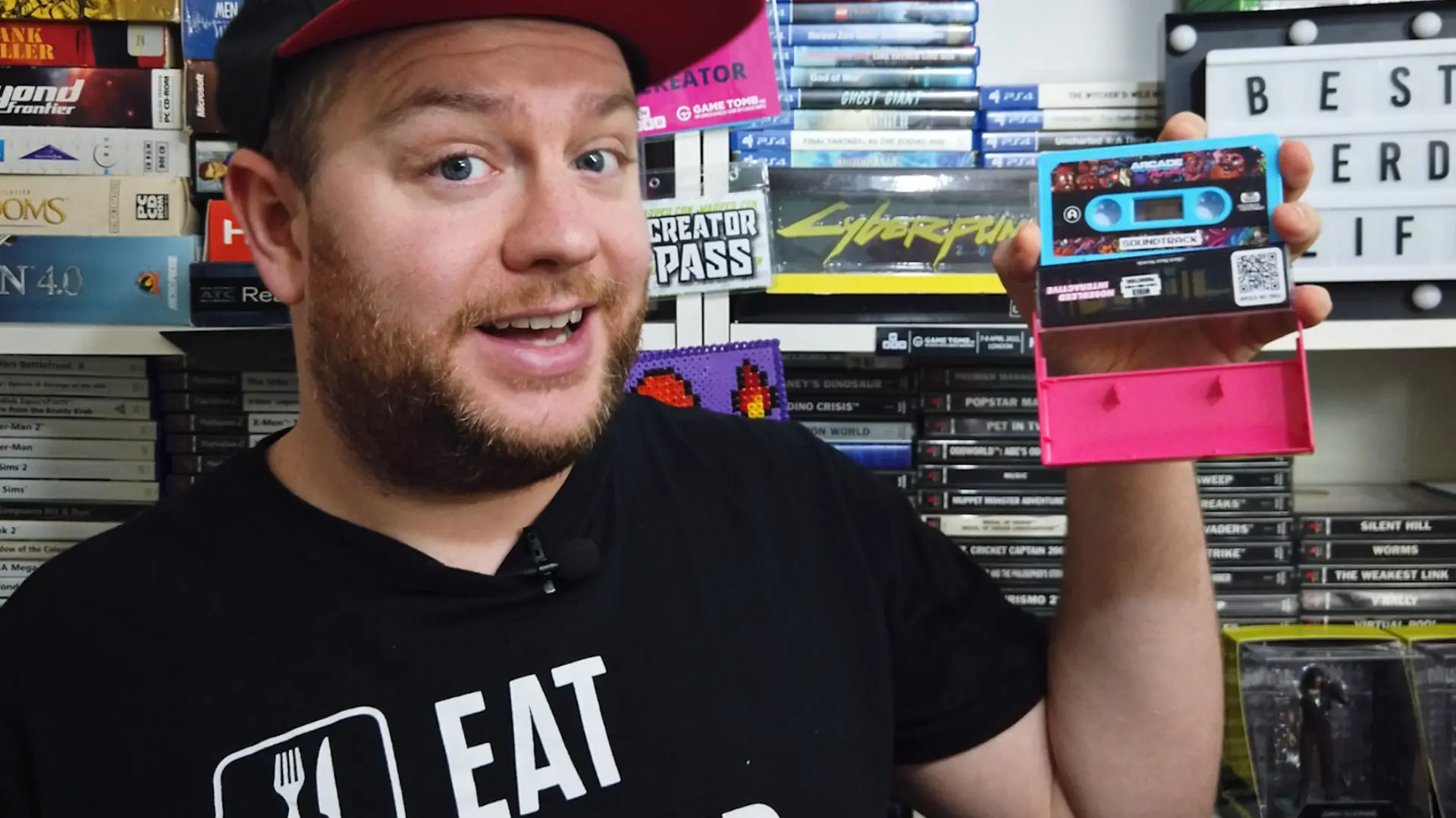 A photo of me holding a Arcade Paradise themed cassette