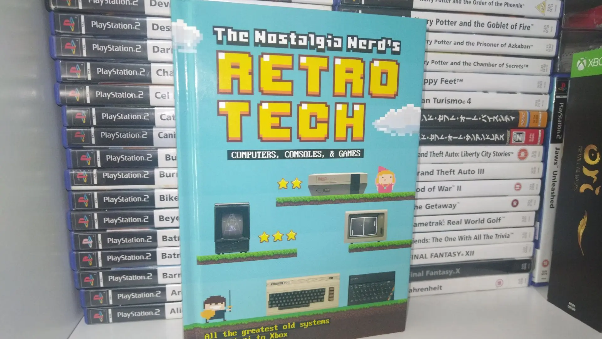 A photo of Nostalgia Nerd's Retro Tech book on a shelf