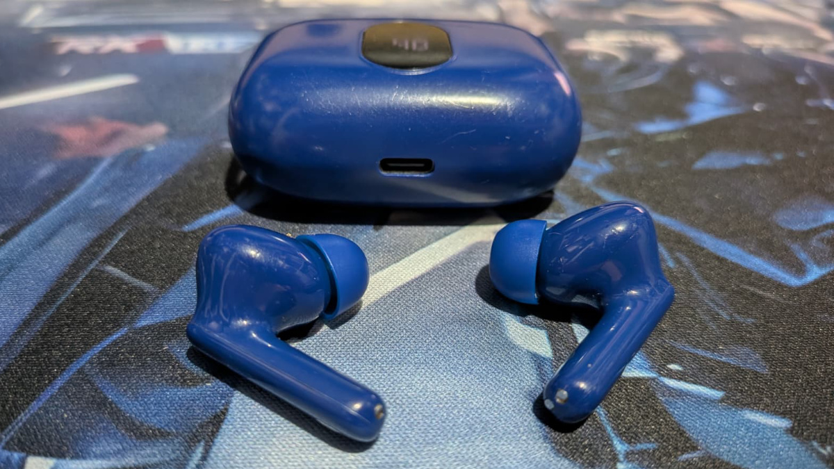 A photo of my world-worn pair of Btootos A90 Pro wireless earbuds